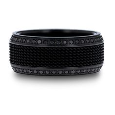 a black ring with diamonds on it