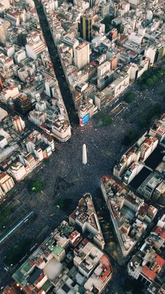 an aerial view of a city with lots of tall buildings