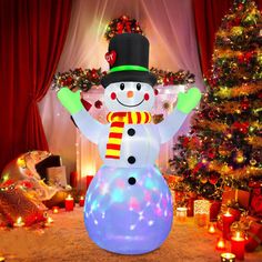 an inflatable snowman standing next to a christmas tree and decorated with lights