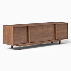 the sideboard is made from wood and has three doors