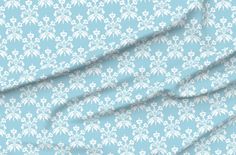 a blue background with white flowers on it