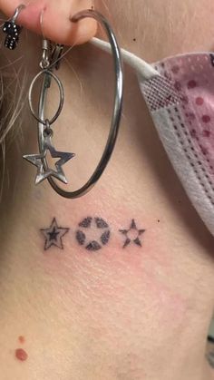 a close up of a person's neck with tattoos on her left side and the word love written in cursive writing