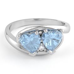 Two hearts in one love ring set with a aquamarine and a diamond is a sign of a lasting connection and trust. Crafted in solid 10k white gold. Aquamarine is a birthstone of March and signifies hope, health, youth, and fidelity. Diamonds are thought to provide the wearer with better relationships and increase inner strength. Make a keepsake with 2 lovers' interchangeable birthstones as a symbol of an everlasting relationship. Genuine Aquamarine: Qty: 2 x 4mm Heart Cut Stone Genuine Diamonds: .01 c 14k White Gold Topaz Birthstone Promise Ring, Aquamarine Birthstone Diamond Promise Ring, Light Blue Promise Ring With Birthstone, Light Blue Birthstone Ring For Promise, Heart Cut Blue Topaz Promise Ring, Anniversary Heart Cut Topaz Ring In Sterling Silver, Heart Cut Blue Topaz Rings For Anniversary, Blue Topaz Diamond Promise Ring With Birthstone, Anniversary Three-stone Blue Topaz Jewelry