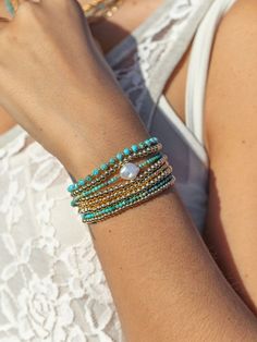 "This dainty turquoise bracelet comes accented with a single Keishi pearl that puts forth a glistening glow. Layer these with our other beaded beauties for an elegant boho statement. ✦ DETAILS ✦ ✧ Name: Kawena (ka-VEH-na) - the glowing one. ✧ Adjustable Length from: 6.5\"-8\". ✧ Genuine 2.5mm faceted tiny Turquoise Beads. ✧ Genuine 10mm avg. AAA Keishi Pearl ✧ 14kt Gold Filled Components, Extender, and Clasp. ✧ All Ke Aloha Jewelry pieces come packaged thoughtfully, beautifully, and ready for gi Adjustable Turquoise Bohemian Pearl Bracelet, Turquoise Stackable Beaded Bangle Bracelets, Turquoise Stackable Bangle Beaded Bracelets, Bohemian Turquoise Pearl Bracelet With Round Beads, Bohemian Turquoise Pearl Bracelet For Gift, Elegant Turquoise Bracelets For Beach, Turquoise Bohemian Pearl Bracelet, Stackable Turquoise Wrap Bracelet, Turquoise Beaded Pearl Bracelet Gift