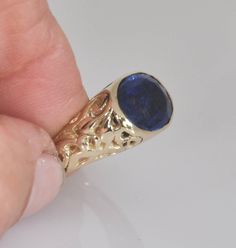 "Wide unique gold statement ring. Hand made, 14k solid gold ring with beautiful blue Kayanite. This special hand carved wide solid gold ring is a perfect fine jewelry gift for a special person you care about and love. The ring sides are decorated with delicate eastern-romantic ornaments and through them you can see the blue shade of the Kayanite. The ring is 14k solid gold, completely handmade by me in a unique wax engraving technique, I can make this ring in rose or white gold. * The ring is 14 Oval Blue Signet Ring In 14k Gold, Oval Sapphire Signet Ring In 14k Gold, Blue Oval Signet Ring Stamped 14k, Blue 14k Stamped Oval Signet Ring, Oval Sapphire Signet Ring In Gold, Blue 14k Gold Signet Ring With Gemstone, Blue 14k Gold Signet Ring Fine Jewelry, Blue 14k Stamped Signet Ring, Luxury Blue Carved Jewelry