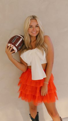 Look fancy and take your game day wardrobe to the next level with this Keep it Fun Tulle Skirt! This showstopper is sure to turn heads with its bright orange hue and fun, frilly tulle fabric. Sparkle all the way to the finish line! available for in store credit or exchange (see policy for more info) Filter used to brighten color Orange Gameday Outfit, Sisterhood Round, Top Graphic Tees, Tulle Fabric, Swim Accessories, College Dorm, Finish Line, Bright Orange