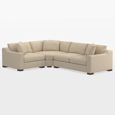 a large sectional couch sitting on top of a white floor