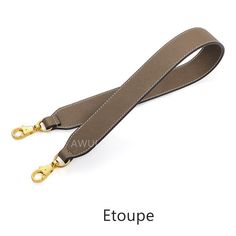 an image of a lanyard strap with gold buckles on it and the words etoupe written below