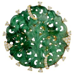 This beautiful ring is cast in 18 Karat gold. It is hand set in 12.34 carats Jade and .58 carats of sparkling diamonds. FOLLOW MEGHNA JEWELS storefront to view the latest collection & exclusive pieces. Meghna Jewels is proudly rated as a Top Seller on 1stDibs with 5 star customer reviews. All items manufactured by us are handmade and can be customized or redesigned. Composition Size-US-7 Total Weight-11.637 Gold Weight(Gms)-9.054 Diamond Wt(Cts)-0.58 Jade Wt(Cts)-12.34 Luxury Emerald Ring With Diamond, Round Emerald Ring With Pave Diamond Setting, Luxury Emerald Ring With Single Cut Diamonds For Anniversary, Luxury Hallmarked Emerald Ring With Diamond, Formal Round Emerald Ring With Single Cut Diamonds, Art Deco Round Jewelry With Pave Setting, Art Deco Jewelry With Pave Setting, Art Deco Round Pave Set Jewelry, Sapphire Cocktail Ring