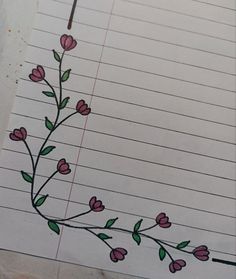 a piece of lined paper with pink flowers on it and green leaves drawn on the side