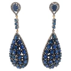 A gorgeous pair of earrings set in silver, with a 2.40-carat diamond and a natural 24.12-carat blue sapphire. Diamonds Earrings, Sapphire And Diamond Earrings, Natural Blue Sapphire, Earrings Set, Blue Sapphire, Earring Set, Jewelry Earrings Dangle, Diamond Earrings, Sapphire