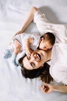 a man and woman laying on top of each other