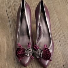 J. Vincent Brand High Heels In Size 9½. They Are New Without Tags, And In Absolutely Beautiful Condition! The Color Is Deep Plum, With A Dark/Deep Bronze/Gray Line Around The Top And Down The Back. One Flower On The Toe Is Velvet, The Other Leather. Really, Really Pretty Shoes! Purple Pointed Toe Heels For Formal Occasions, Purple High Heels For Formal Occasions, Purple Heels For Spring Formal, Purple Spring Formal Heels, Spring Formal Purple Heels, Elegant Purple Heels For Formal Occasions, Elegant Purple 4-inch Heels, Chic Purple Heels For Formal Occasions, Chic Purple Heels For Formal Events