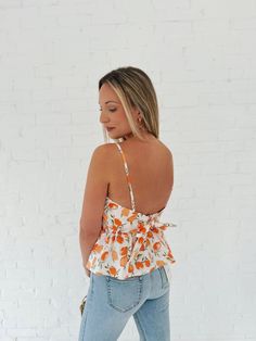 Turn heads and make a statement in this Southern Bell Smocked Top! This sassy yet fun peachy top features a smocked front, an open back, and matching bottoms. Perfect for those hot summer days - or your next vacay. Details: Length: 21" Bust: 32" Materials: SELF : 97% COTTON 3% SPANLINING : 100%COTTON Fitted Smocked Top For Beach, Summer Cotton Smocked Top With Smocked Back, Cotton Smocked Top With Smocked Back For Summer, Sleeveless Smocked Top For Summer, Chic Cotton Smocked Top For Beach, Chic Smocked Top With Smocked Back For Summer, Spring Smocked Back Top For Brunch, Sleeveless Top With Smocked Back For Brunch, White Smocked Top For Summer Brunch