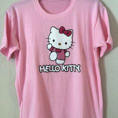 Baby Pink Hello Kitty T-Shirt Casual Pink Hello Kitty T-shirt, Trendy Cotton T-shirt With Hello Kitty Print, Kawaii Pink T-shirt With Cat Design, Kawaii Pink Cat Design T-shirt, Pink Hello Kitty T-shirt For Spring, Trendy Pink Hello Kitty T-shirt, Hello Kitty Kawaii T-shirt For Spring, Kawaii Hello Kitty T-shirt For Spring, Spring Kawaii Hello Kitty T-shirt