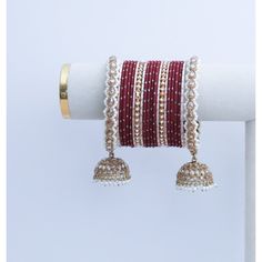 Personalize your style with customizable bangles, crafted to reflect your unique taste. Choose your colors, designs, and embellishments for a truly one-of-a-kind accessory. Festive Bangle With Round Beads, Handmade Temple Jewelry Bangle For Celebration, Traditional Red Bangle For Rituals, Festive Bangle With Latkans For Festivals, Adjustable Gota Work Jewelry For Party, Festive White Bracelets With Latkans, Bollywood Bangle With Latkans For Festive Occasions, Bollywood Style Bangle With Latkans For Festive Occasions, Festive Bangle Bracelets With Latkans