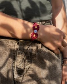 In a sea of delicately tied crimson and knots, lies a spherical Moon stone with small wood beads on each side.  This bracelet will go with any color combination of clothing.  Moonstones enhances intuition, promote inspiration, success and good fortune in love.  Our jewelry is made out of high density, quality polyester fiber.  All items are hand knotted in mini macrame technic. Spiritual Macrame Beaded Bracelet, Macrame Stone Bracelet, Adjustable Moon-shaped Jewelry With Natural Stones, Festival Macrame Moonstone Jewelry, Macrame Necklace Stone, Inner Growth, Mini Macrame, Mini Moon, Good Fortune