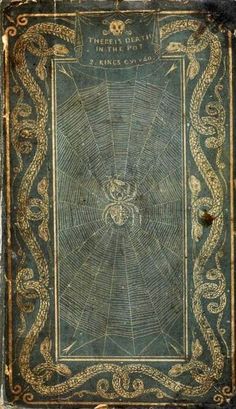 an old book with intricate designs on it