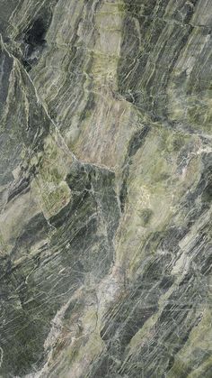 an image of marble textured with green and brown colors on the surface that looks like it has been cut in half