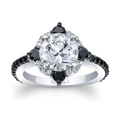 an engagement ring with black and white diamonds