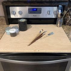 the kitchen counter is clean and ready to be used as a stove top with utensils on it