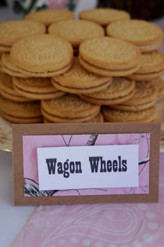 a table topped with lots of cookies next to a pile of cookies