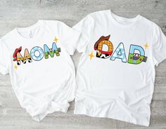 two t - shirts with the words mom and dad printed on them