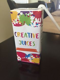 a juice carton sitting on top of a table with the words creative juices printed on it