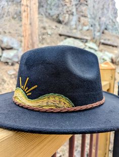 "Up your fashion game this spring with this addition to your closet. This gorgeous bohemian style wide-brim felt hat with a hand-embroidered mountains and sun scene. Eclectic, boho and modern style all in one! A wonderful item to add to your closet for any woman who likes to stand out and make a statement with her fashion. Adjustable ❁ Fashionable ❁ One Size Fits Most ❁ Sun Protection ❁ Statement Piece ❁ Hand Embroidered  This is a beautiful one-of-a-kind, hand stitched statement fashion piece - no two designs are alike. Each hat I make is carefully curated, designed and hand-embroidered. I am very inspired by vintage, 60s and 70s fashion and love to design embroidery pieces that I would love to wear. I am dedicated to making you satisfied with you purchase. Please message me for custom re Bohemian Wide Brim Felt Hat, Bohemian Felt Hat For Spring Festival, Black Embroidered Bohemian Hat, Bohemian Black Embroidered Hat, Bohemian Embroidered Fedora Hat, Bohemian Flat Brim Felt Hat For Spring, Bohemian Spring Felt Hat With Flat Brim, Bohemian Fedora Felt Hat For Outdoor, Bohemian Hats For Outdoor Fall Activities