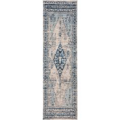 a blue and white runner rug with an ornate design