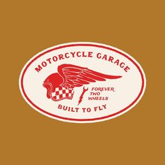 a red and white motorcycle garage sticker on a brown background with the words,'built to fly '