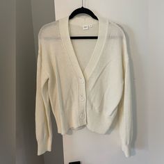 Gap, Short Cardigan With Buttons, Size Medium. Great Condition - Never Worn. Everyday White V-neck Cardigan, Classic Gap Cardigan For Fall, Classic Gap Fall Cardigan, Trendy White Button-up Cardigan, White V-neck Everyday Cardigan, Gap Button-up Cardigan For Fall, White Button-up Sweater For Fall, Gap Long Sleeve Cardigan For Spring, Classic White Everyday Cardigan