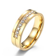 a yellow gold wedding ring with white diamonds