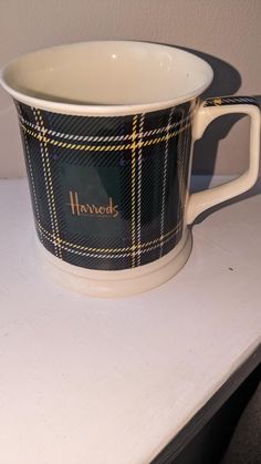 a coffee cup sitting on top of a counter