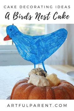 a blue bird sitting on top of a cake