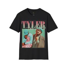 Show your admiration for one of the most innovative artists in modern music with this retro Tyler, The Creator Graphic T-Shirt. Featuring a bold and vibrant design of Tyler in his signature style, this shirt is a must-have for any fan. Made from soft, premium cotton, it offers comfort without compromising on style. Perfect for everyday wear, concerts, or as a standout piece in your streetwear collection, this T-shirt celebrates Tyler, The Creator's unique influence on music and fashion. Whether Hip Hop Graphic T-shirt For Concerts, Pop Culture Graphic Print T-shirt For Concert, Pop Culture Streetwear Tops With Graphic Design, Pop Culture Graphic Design Tops For Streetwear, Hip Hop Graphic Print T-shirt For Concerts, Graphic Tee With Logo For Music Festivals, Graphic Tee With Logo Print For Music Festivals, Pop Culture Sublimation Print Top For Streetwear, Retro Graphic Design Tops For Streetwear