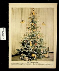 an old fashioned christmas tree with presents on it