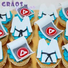 cupcakes decorated with karate uniforms and ribbons