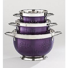 three purple colanders stacked on top of each other