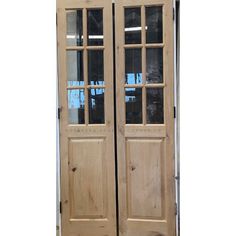 two wooden doors with glass on each side