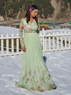 A majestic mint green floral anarkali gown from the Nikita Tiwari collection. This beautiful mint green pleated anarkali has full sleeves in floral print. The mint green color with hand-embroidery work enhances the graceful georgette anarkali. The hand-embroidered anarkali has intricate pearl-sequin details with multicolor floral and vibrant bird print. The anarkali gown in viscos georgette fabric is a perfect fit for any event. Festive Pista Green Dress With Floral Print, Pista Green Anarkali Dress With Floral Print, Green Long Sleeve Anarkali Set, Green Georgette Anarkali Set With Long Sleeves, Green Anarkali Set With Floral Print And Long Sleeves, Green Long Sleeve Anarkali Set With Floral Print, Green Floral Print Long Sleeve Anarkali Set, Festive Pista Green Floral Print Dress, Green Bollywood Floral Print Anarkali Set