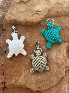 three keychains made to look like sea turtles