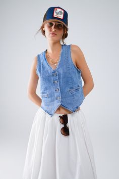 The Fitted Denim Vest is a staple piece for any wardrobe, providing versatility and style. Made from high-quality denim, it offers durability and comfort. With its timeless design, it can be dressed up or down for any occasion. Add it to your collection today. 4 button front closure Decorative pockets V-neck Faux welt pockets Material Cotton elastane blend Machine washable Spring Denim Top With Buttoned Pockets In Medium Wash, Trendy Cotton Denim Vest With Snap Buttons, Spring Medium Wash Denim Top With Buttoned Pockets, Spring Washed Denim Vest For Workwear, Casual Cotton Denim Vest With Buttons, Spring Washed Denim Vest For Work, Button-up Cotton Jeans For Everyday, Medium Wash Button-up Outerwear For Summer, Cotton Button-up Jeans For Everyday