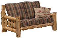 a couch made out of logs with pillows on the back and arm rests against it