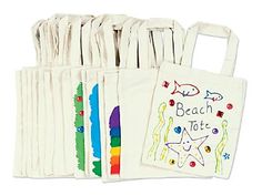 beach tote bags are lined up with different designs on the front and back side