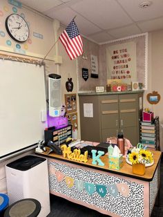 a classroom with desks and decorations on it