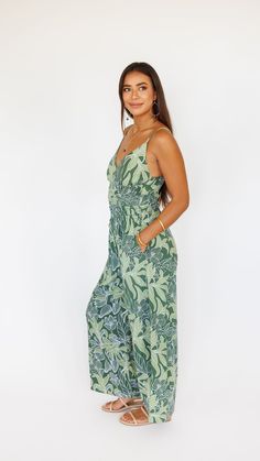 Stand out in this stunning jumpsuit, made to flow with buttery soft rayon and an exaggerated wide pant leg. Features adjustable straps and a gentle smocked waist to flatter. ** Our Model is 5'8" and wearing a size SMALL. ** Fabric and Care Instructions: *100% Rayon *Hand wash cold * Line Dry Bohemian Jumpsuits And Rompers With Smocked Bodice, Bohemian Sleeveless Jumpsuits And Rompers With Smocked Bodice, Bohemian Sleeveless Jumpsuit With Smocked Bodice, Casual Spaghetti Strap Jumpsuits And Rompers With Smocked Back, Beach Maxi Dress With Elastic Waistband, Beach Maxi Dress With Elastic Waistband And Wide Leg, Vacation Jumpsuit With Smocked Back And Spaghetti Straps, Bohemian Jumpsuits And Rompers With Smocked Back For Spring, Casual Wide Leg Maxi Dress For Vacation