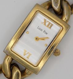 Luis Pion, women's watch, gold plated, water resistant 3 atm, prestige watch. numbered, collector's watch, rectangular watch, Roman numeral. Dimension: 3 x 1.5 Gold Analog Watch With Rectangular Face, Gold Rectangular Analog Watch, Rectangular Gold Analog Watch, Gold Rectangular Analog Jewelry And Watches, Rectangular Watch, Roman Numeral, Women Wrist Watch, Women's Watch, Roman Numerals