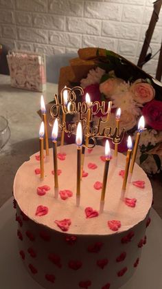 a birthday cake with candles that say happy birthday