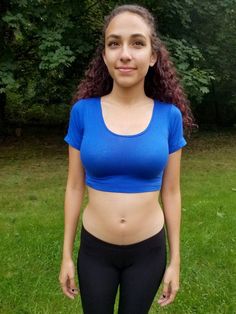 "This short sleeve form-fitting blue crop top is made from a stretchy cotton spandex fabric.   Worn With: Our Black Ultra Low Rise Capri Leggings. The model is 5'5\" and wearing a size small.  Size Chart (inches):                              S            M           L Bust                  26-30   30-34     34-36 Natural Waist  23           24            26 Length                12             13     14  Materials:  95% cotton, 5% spandex. Custom print on this crop top: Yes. You can request your own design on this crop top. There is a $16 custom design fee added to the price of the top. Local Pickup Available: Yes.  If you live in the south bay area in San Diego, you can pick up your crop top and receive up to 20%off.  Payment will be due on pickup. Country of Manufacture: Made in Califor Sporty Fitted Crop Top T-shirt, Stretch Cotton Sports Crop Top, Stretch Cotton Crop Top For Sports, Sporty Fitted Cropped Shirt With Crew Neck, Short Sleeve Cropped T-shirt For Workout, Basic Cropped Short Sleeve T-shirt For Workout, Basic Cropped Workout Crop Top, Sporty Stretch Cropped Shirt With Short Sleeves, Basic Cropped T-shirt For Workout